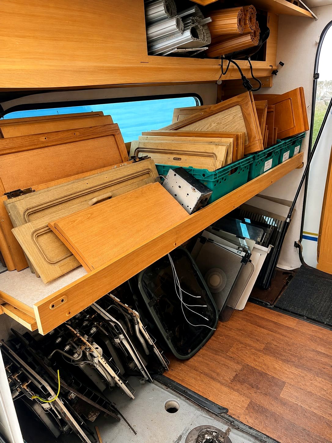 Caravan tables, doors and interior boards racked in the caravan store